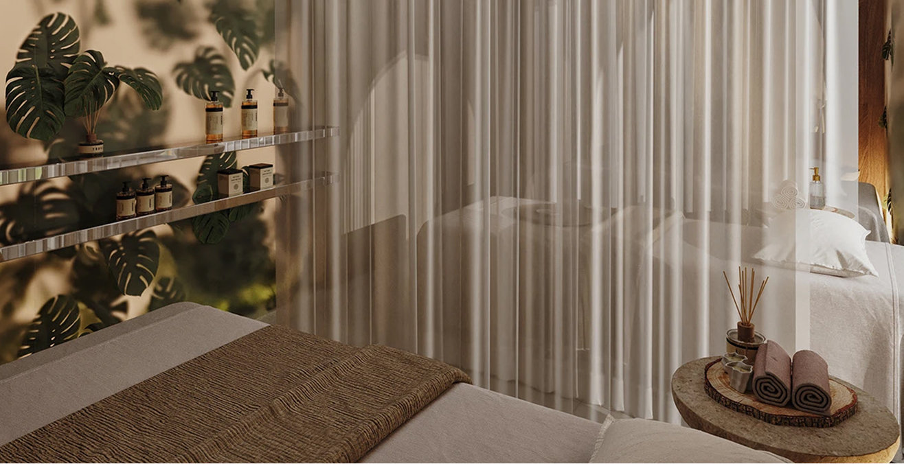 Ambiance cocooning d'une cabine de soin avec table de massage chez Sensibelle à Bordeaux